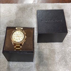 Gold Michael Kors watch with crystal detailing